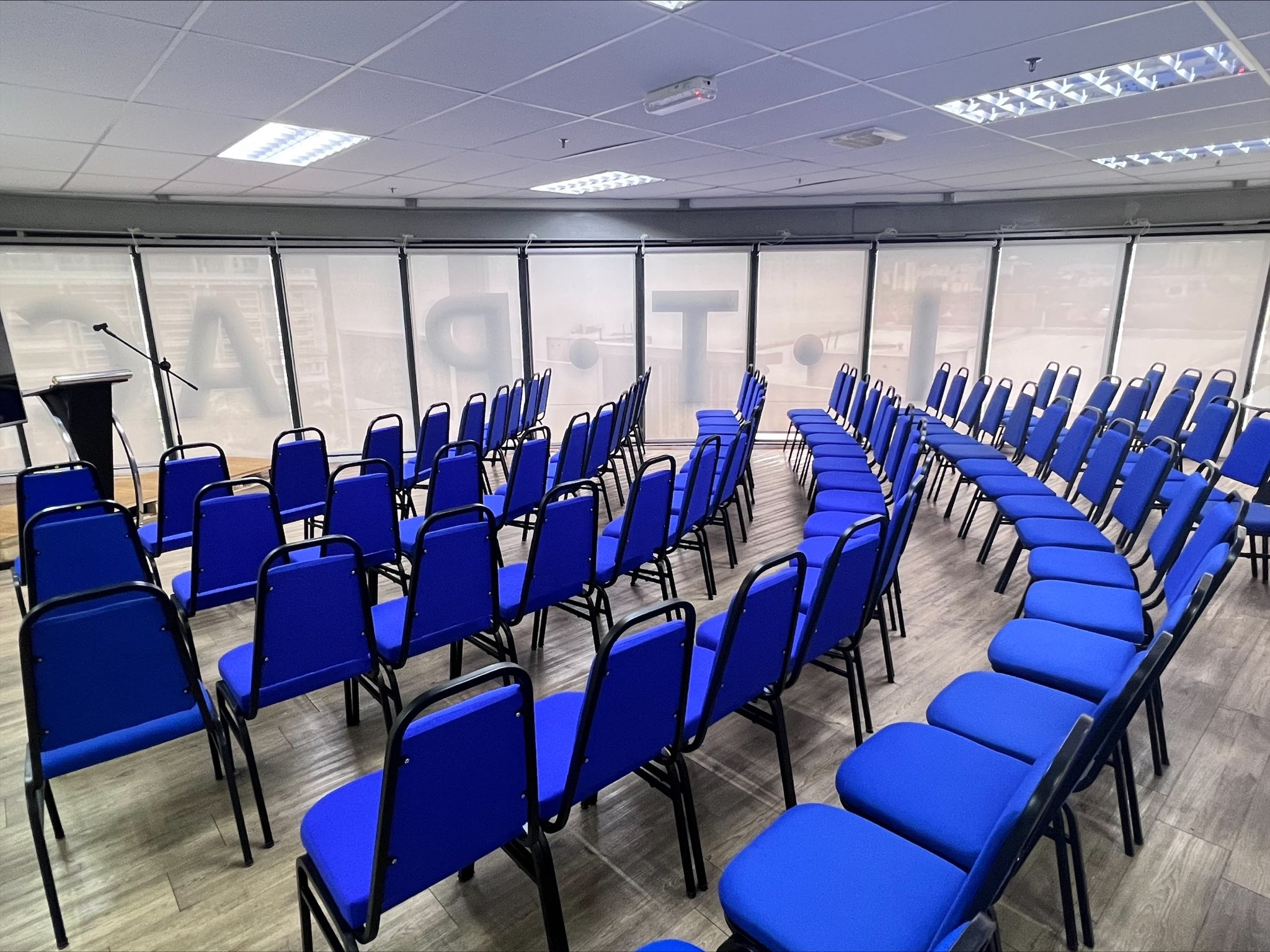 Blue theatre-style seating beside the windows at ITPA Penang