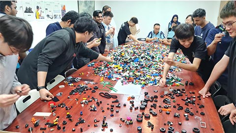 Participants taking part in the building-block car challenge