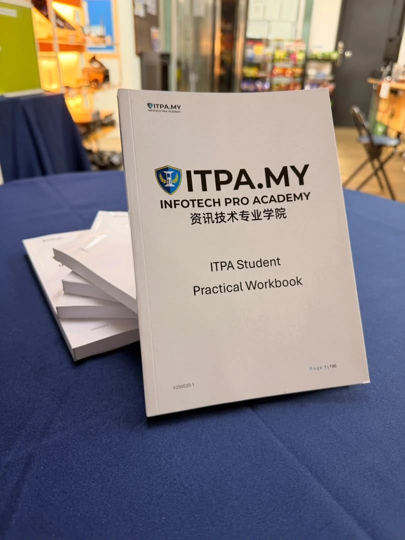 Printed ITPA Student Practical Workbook displayed on a table