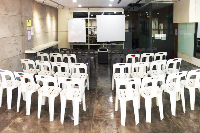 Kuala Lumpur room arranged in theatre style with white chairs