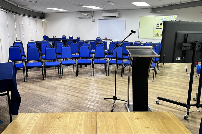 ITPA Penang seminar room with lectern microphone screen and rows of chairs