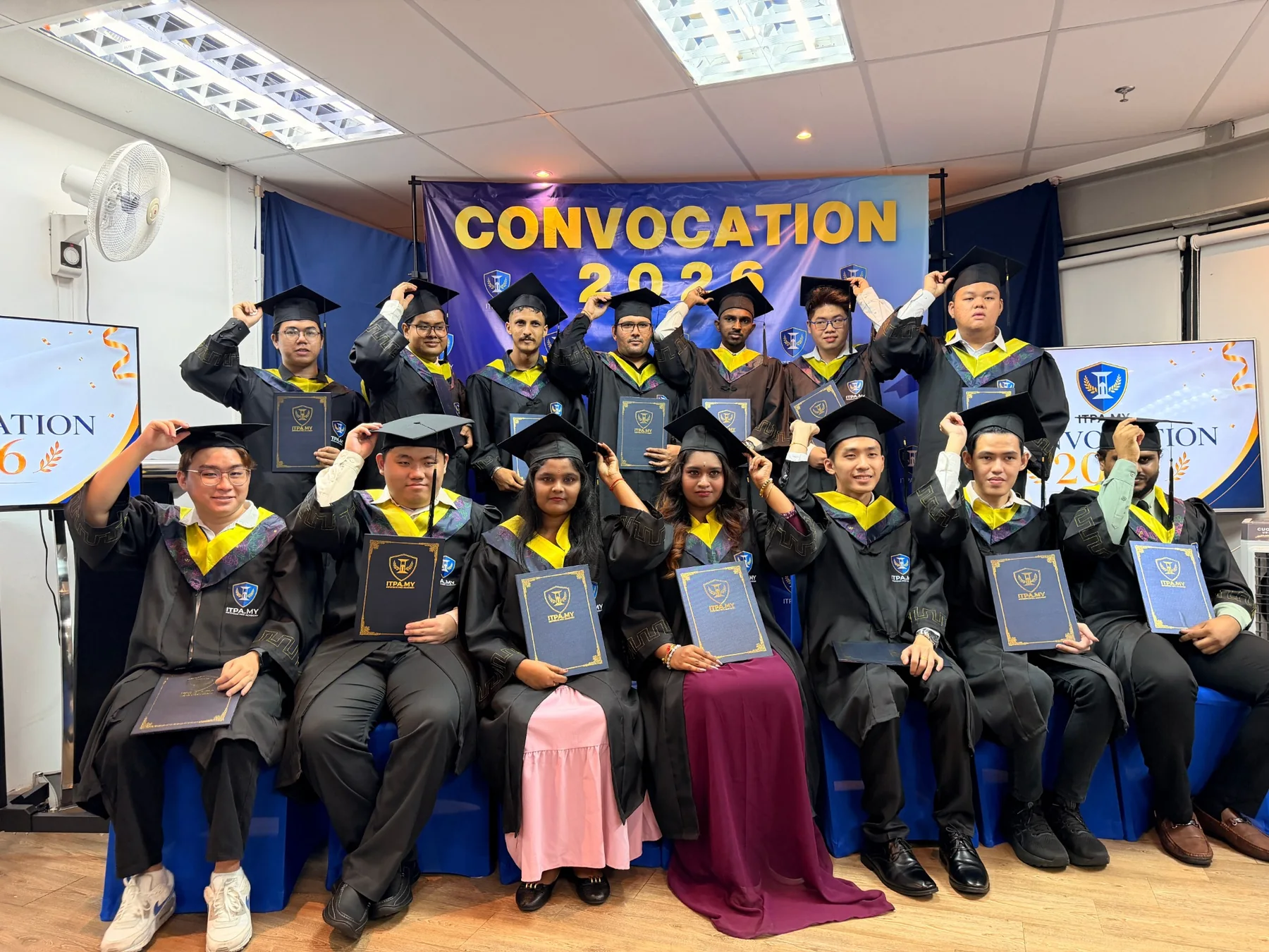 ITPA 2026 graduates celebrating in graduation gowns
